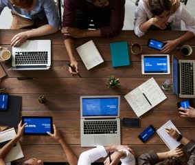 Top View Photo Of People Near Wooden Table